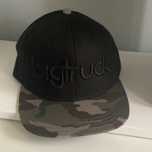 BRAND NEW Bigtruck, black on black baseball hat w/ camouflage bill. 59cm.